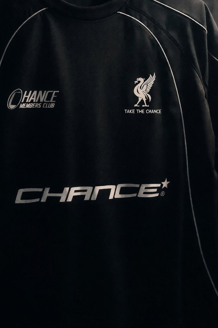 Black sweatshirt with 'Chance' branding on a dark background